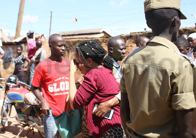   survivor is led away from the scene hoto by dward isoma