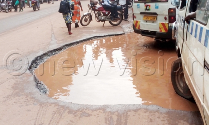 Potholes still eating up Kampala roads Potholes still eating up Kampala roads