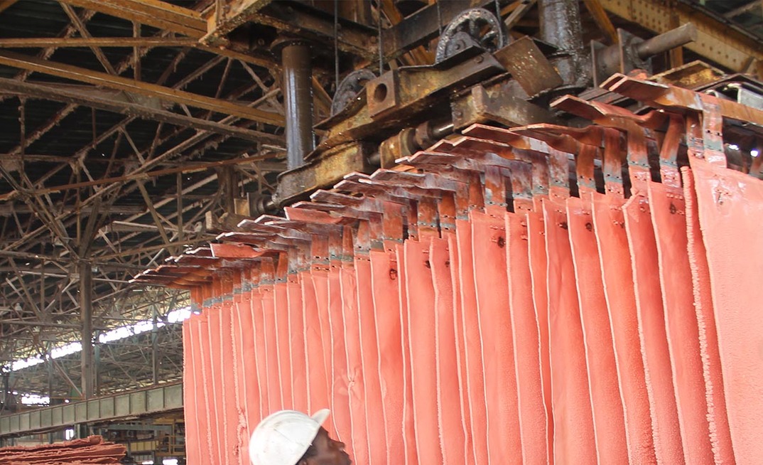 A worker handles copper plates at a Gecamines operation. Photo: Gecamines