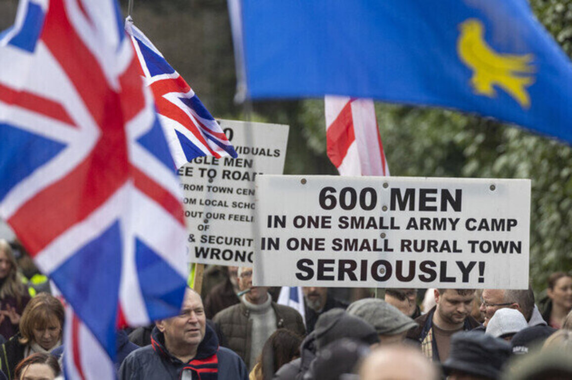 Thousands protest new migrant camp in UK