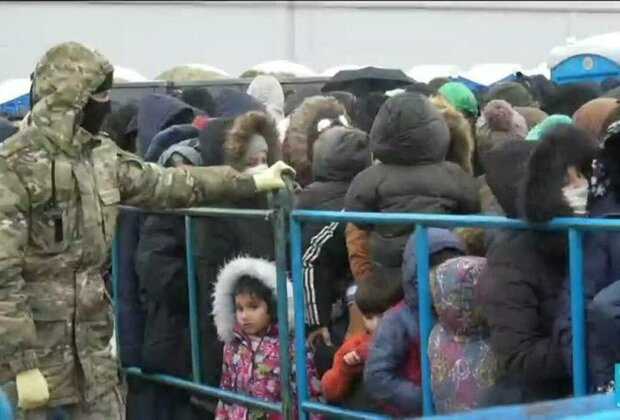 Snow delights children, but blocks migrants at Belarus border