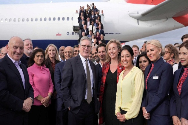 British PM Starmer joins his business delegation for a photo at London's Heathrow airport ahead of India visit