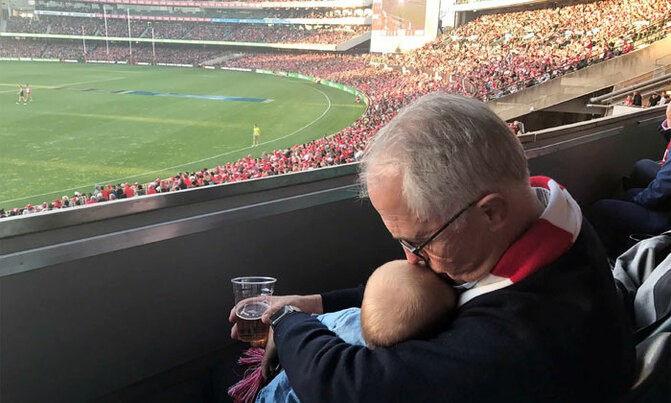 Australian leader defends baby and beer photo Australian leader defends baby and beer photo