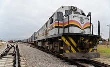  A train hauling copper arrives at the port of Lobito