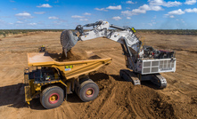 One of Adani's Cat 796ACs being loaded by its Liebherr R996B excavator.