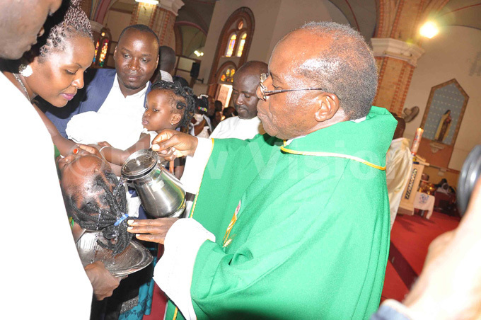  sgr harles asibante baptises a baby during the celebrations