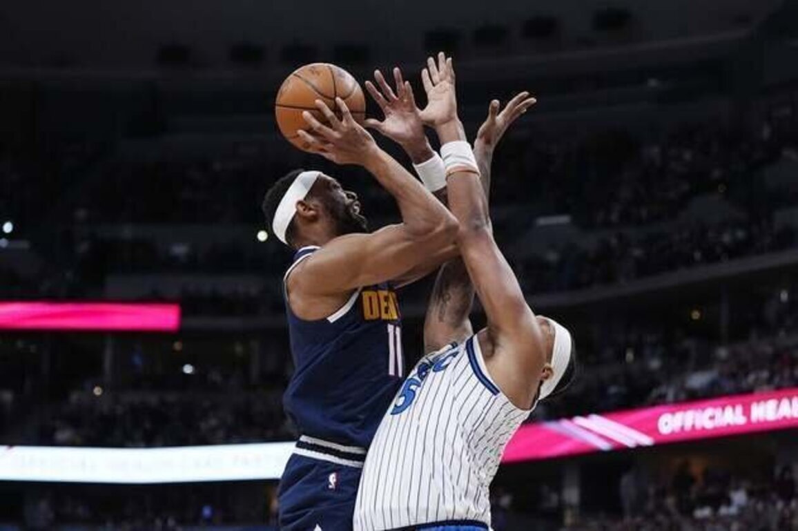 Nikola Jokic becomes assist king among centers as Nuggets top Magic