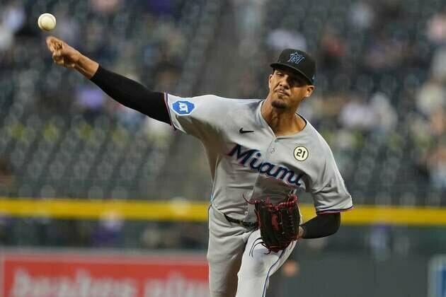 Marlins build 6-run lead, hang on for victory over Rockies