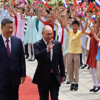 Xi enjoys tete-a-tete with Putin