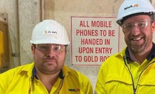 MMS employees Nathan Ramm and Chris Kerr with the first gold bars. Credit: Black Cat.