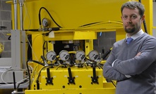  University of Pittsburgh Associate Professor Andy Bunger in front of his lab equipment.