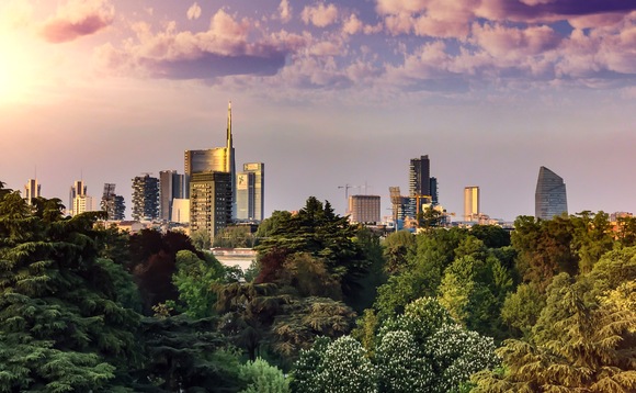 A canopy of trees in front of the Milan skyline | Credit: iStock