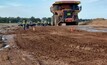 The ground was wet due to a machine having been washed down in the area.