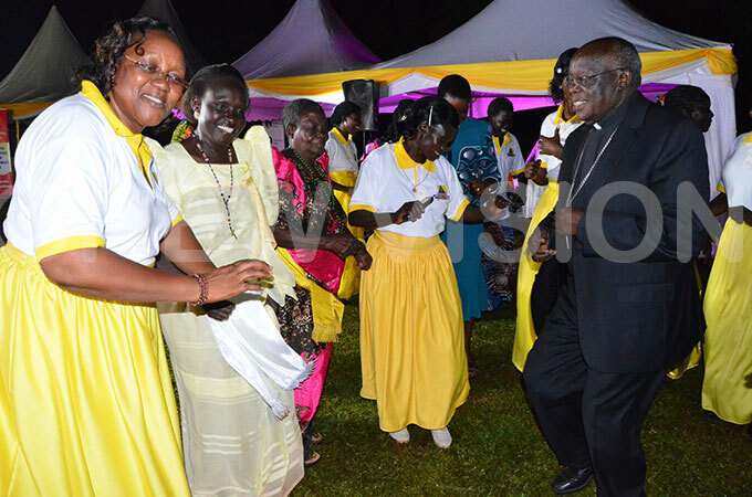  rchbishop dama dances with atholic women during the fundraising dinner
