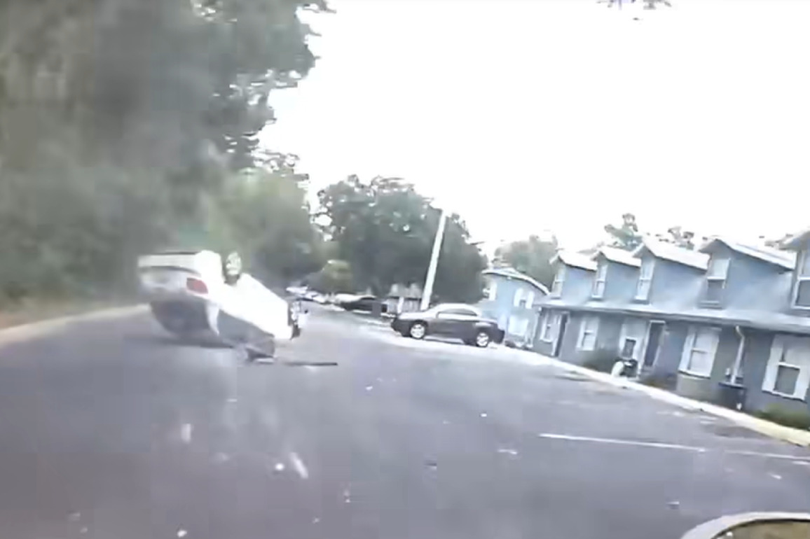 Video- Rifle-wielding suspect flips car during pursuit, continues fleeing on foot before arrest