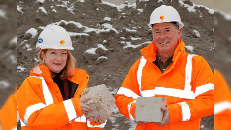 Jill Farrell, Director of Customer Engagement and Communications at Zero Waste Scotland, and Innovative Ash Solutions Director Robert Green holding test blocks of the new end of waste product