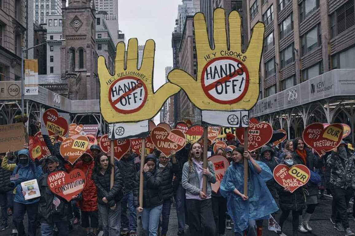 Angry protesters assail Trump and Musk in 'Hands Off!' rallies