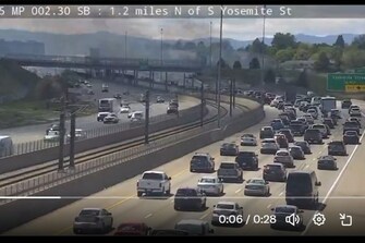 Grass fire burning along I-225 near RTD station under control, officials say