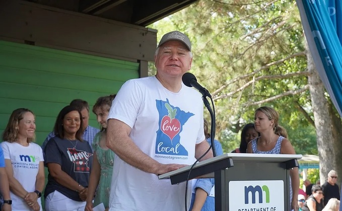 Tim Walz giving a speech at the state fair in 2022 Source: Wikimedia: Office of Governor Tim Walz and Lt. Gov. Peggy Flanagan