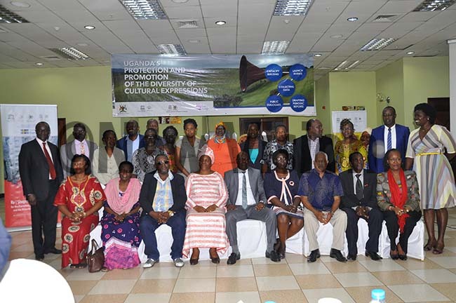 rtists posing for picture with stakeholders after the breakfast meeting hoto by ancy anyonga