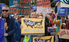 Protestors gathered outside the AICD event. Credit: CCWA