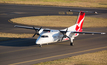 A Qantas Bombardier on a runway