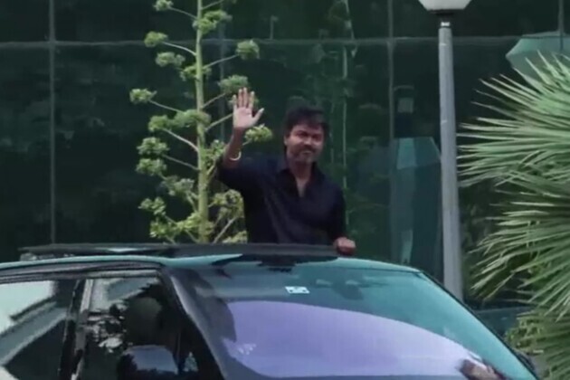 Waving from his car's sunroof, TVK Chief Vijay leaves from CBI headquarters after questioning in Karur stampede case