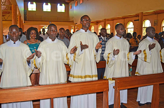  he five major seminarians who presented themselves as serious candidates praying during mass hoto by athias azinga