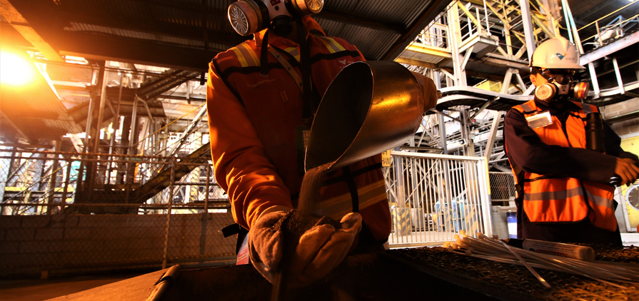 SOROWAKO, INDONESIA - AUGUST 1, 2019: A worker shows the results of the production of nickel ore.