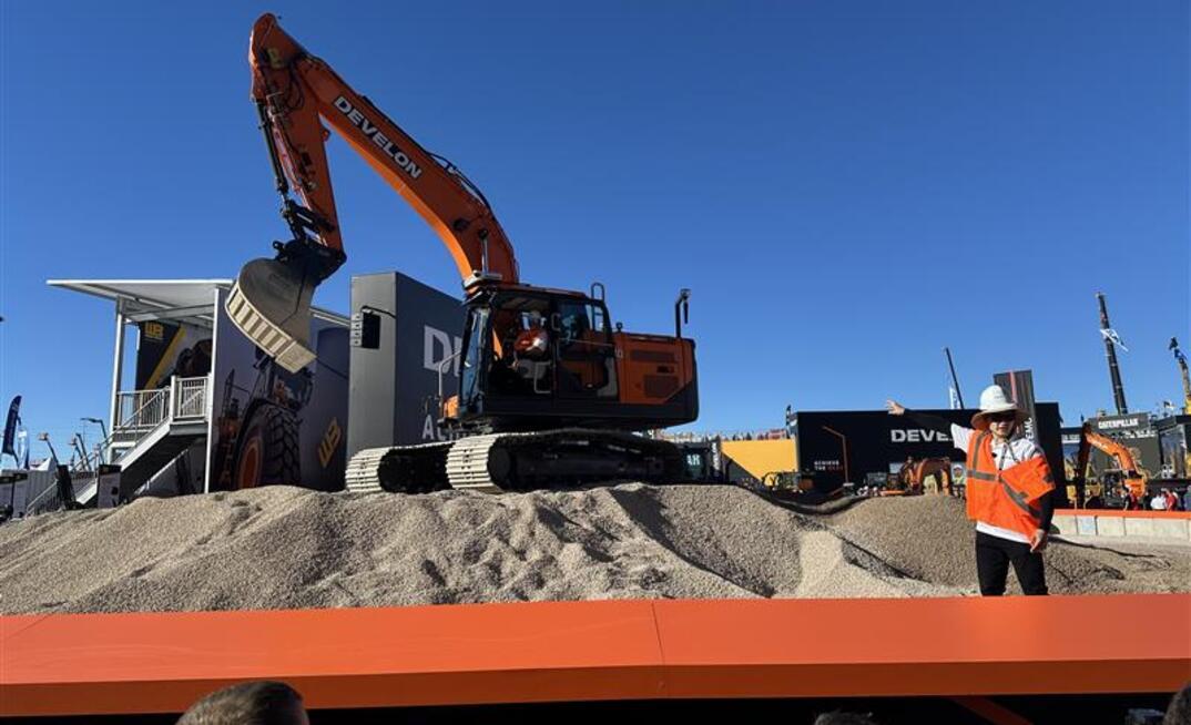 Brian Kim, heavy excavator product manager at DEVELON talks media through the new machines 