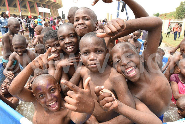  hildren pose for a photo as they enjoyed the swimming pool during the 2017 oto hristmas estival at amboole stadium