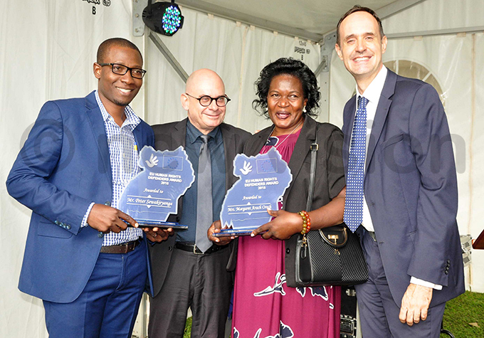 ewakiryanga and roch with the elgian ambassador to ganda ugo erbist right and rwon e andel the elgian deputy head of mission hoto by shraf asirye