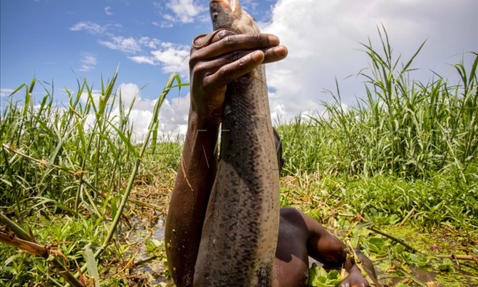 Two Owino market traders resort to fishing Two Owino market traders resort to fishing