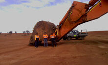 Excavator bucket on site at the Portia mine