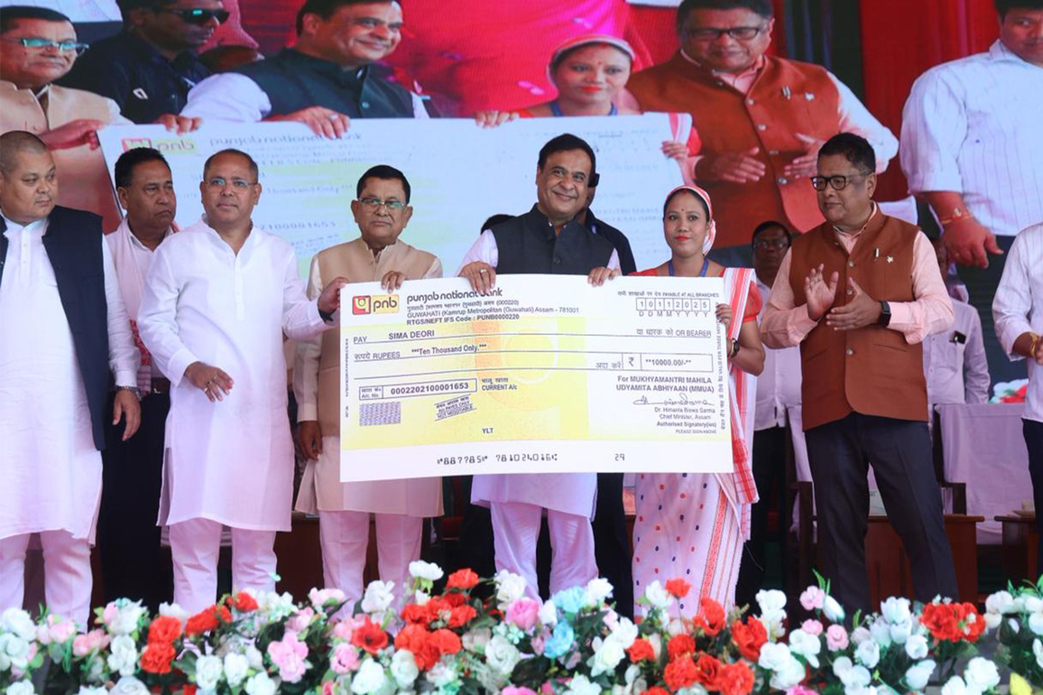 Assam CM distributes cheques to women beneficiaries under MMUA at Sissiborgaon in Dhemaji