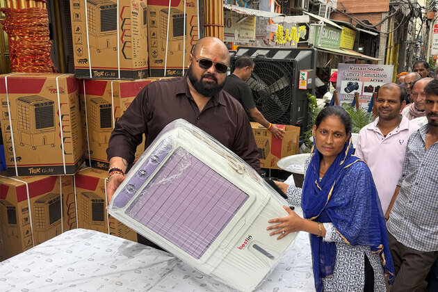 World Champion Mahant Gaurav Sharma distributes air coolers to needy people on his birthday