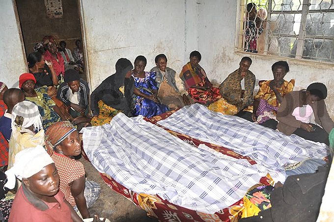 ourners gathered at the home of red alangwa where the bodies of his daughters were brought after they were struck and killed by lightning hoto by enry subuga