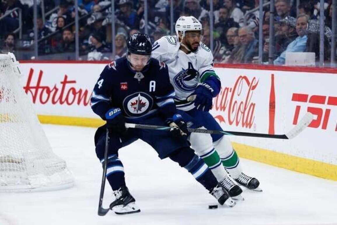 Josh Morrissey's OT goal in return lifts Jets over Canucks