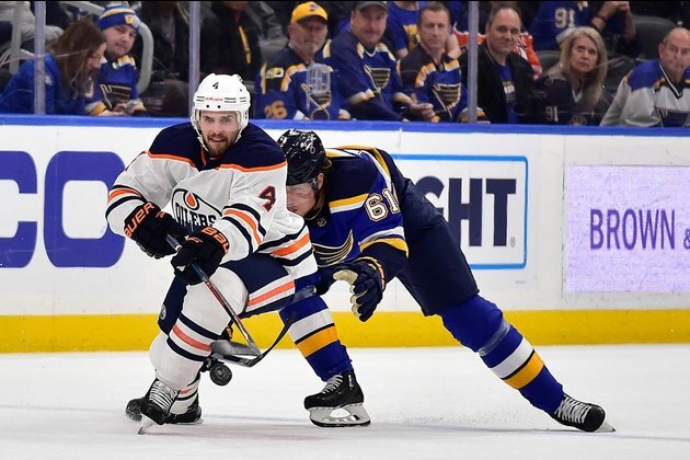 Oilers ink D Russell to contract extension