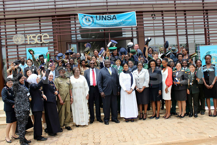  tate minister for defence right wamirama and tate minister for foreign affairs kello ryem pose for group photo with the graduates and other officials 