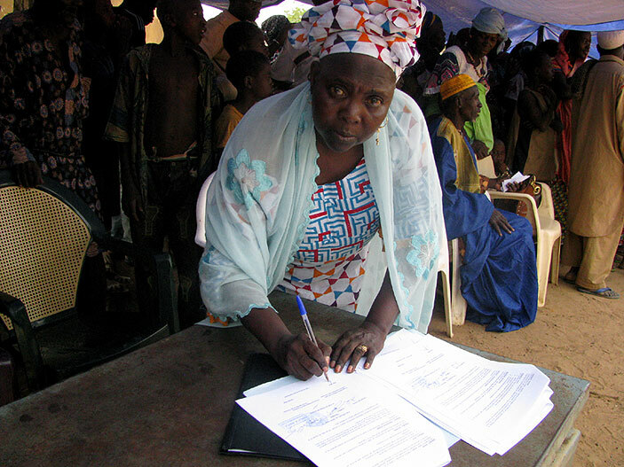  nti  activist adina ocoum aff signing documents during an anti  drive event in ogara on ay 11 2014 lan nternational