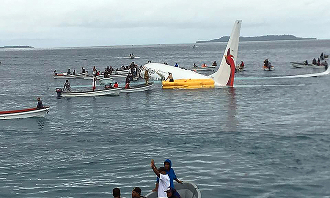 Plane overshoots runway and ditches into lagoon Plane overshoots runway and ditches into lagoon