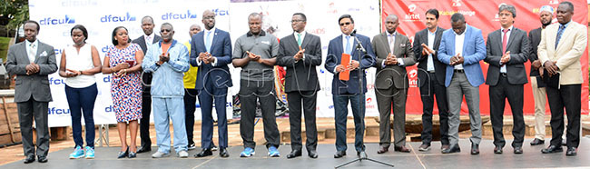  irtel   omasekhar 7th right addresses the press flanked by the atikkiro of uganda harles eter ayiga officials from the uganda government  and sponsors representatives before the launch of kit for this years abaka irthday un at ulange