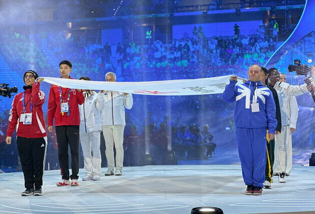 Special Olympics UAE athlete Mina Al Mazrouei raises Special Olympics flag at Opening Ceremony of Turin 2025 Games