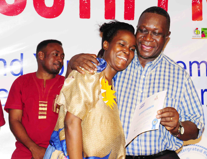  he assistant commissioner for the youth in the ministry of gender labour and social development ondo yateeka hugs iriam amaganda after she was declared winner of the youth music and drama competition 