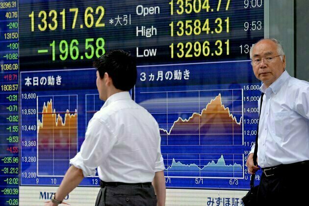 Japan shares end higher as bank stocks rise amid easing financial crisis fears
