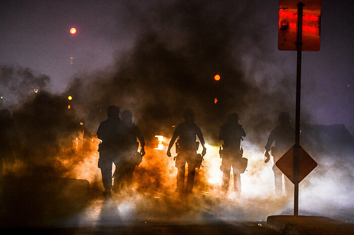 olice use tear gas to disperse protesters during a demonstration in inneapolis innesota on ay 29 2020 over the death of eorge loyd a black man who died after a white policeman kneeled on his neck for several minutes hoto by handan