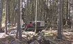  A Geoprobe 8150LS sonic drilling rig snaked between trees on Johns Island off the coast of Maine to install water well service to the house on site