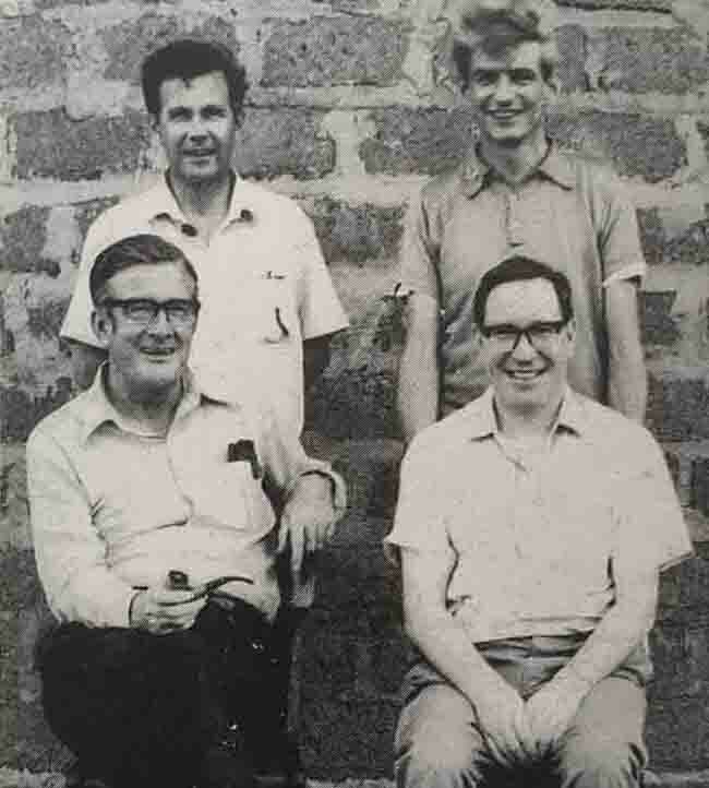  r weeney standing left as a youthful ill ill issonary priest ith him are his colleagues ohn raughan standing right evin cee seated left and the roel anrahan seated right