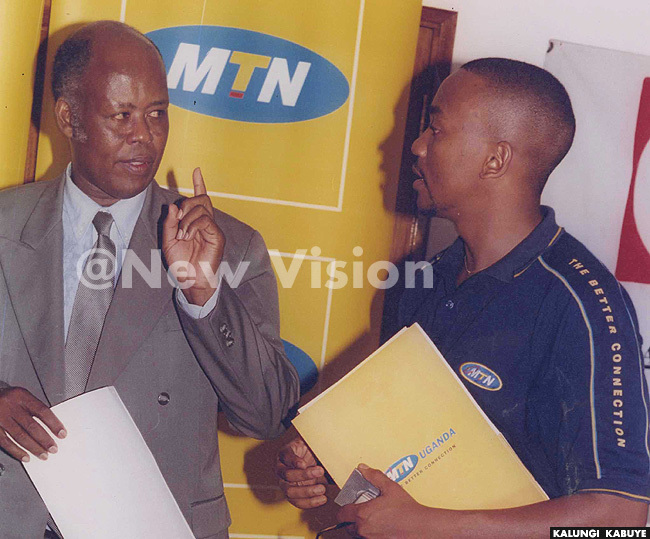 hillip esiimire r with rane anks rancis akurugusi after signing yet another deal  2003